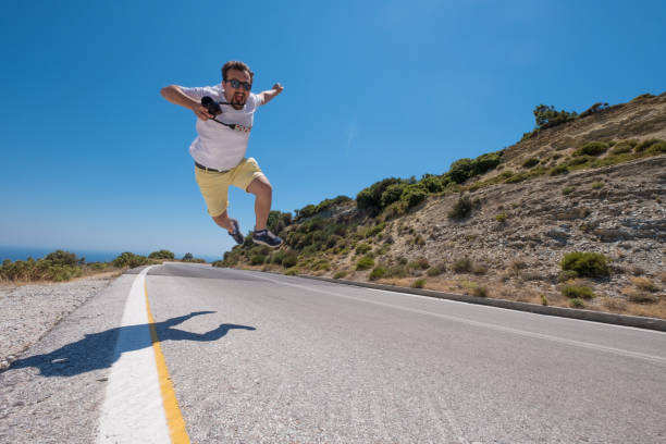 istock Young Man Jumping over the Road 820968912