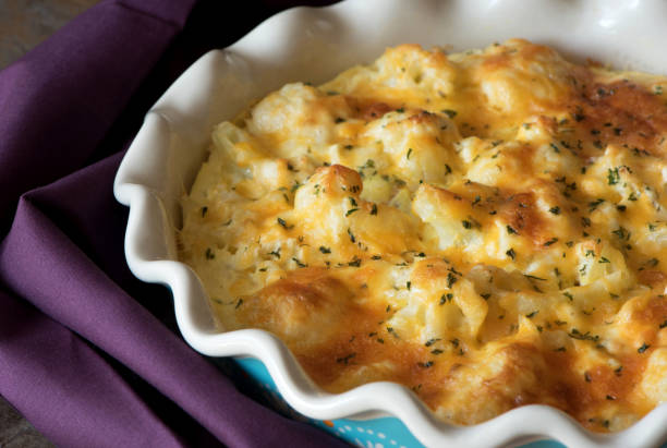Casserole cabbage is sprinkled with cheese and baked, rustic style