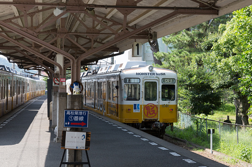 Kotohira, Japan - July 20, 2016 : Kotoden Kotohira Line train at Kotoden-Kotohira Station in Kotohira, Kagawa Prefecture, Shikoku, Japan. It is a railway line in Kagawa Prefecture, which connects Takamatsu-Chikko Station in Takamatsu with Kotoden-Kotohira Station in Kotohira.