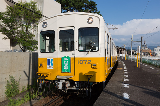 Kotohira, Japan - July 20, 2016 : Kotoden Kotohira Line train at Kotoden-Kotohira Station in Kotohira, Kagawa Prefecture, Shikoku, Japan. It is a railway line in Kagawa Prefecture, which connects Takamatsu-Chikko Station in Takamatsu with Kotoden-Kotohira Station in Kotohira.