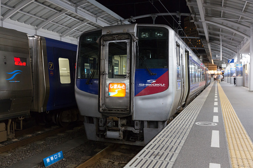 Takamatsu, Japan - July 20, 2016 : JR Shikoku trains at Takamatsu Station in Takamatsu, Kagawa Prefecture, Shikoku, Japan. This station is operated by JR Shikoku. 