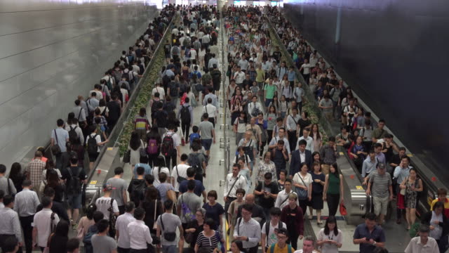 Crowd of pedestrian commuters on train station at Hong kong station