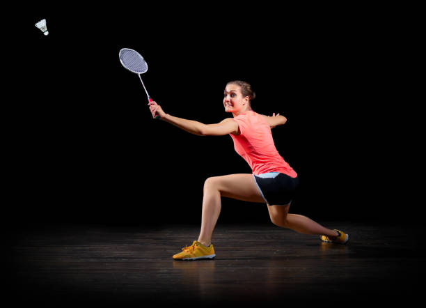 istock Woman badminton player (on black version) 820988754