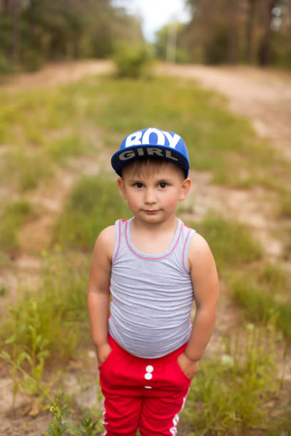 istock A cute boy in a summer park 821002504