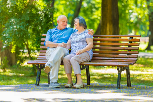 A Displeased Elderly Couple has a Harsh Debate While Sitting in the Park. A Couple of Businesspersons is Having an Unpleasant Talk Due to Relationship Problems.