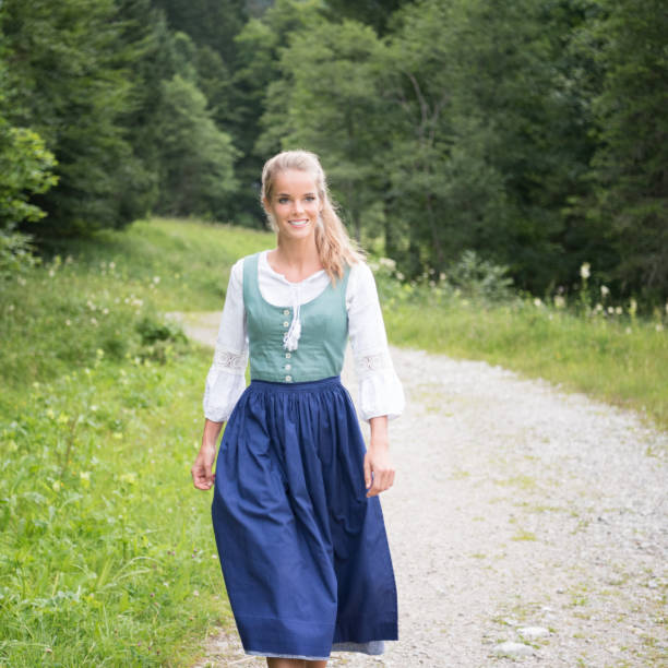 beautiful woman in dirndl costume, austria - dirndl traditional clothing austria traditional culture imagens e fotografias de stock