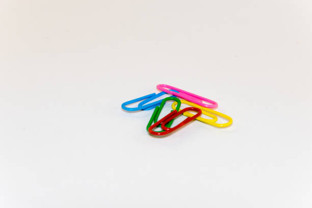 istock Colorful paper clips on white background 821012020