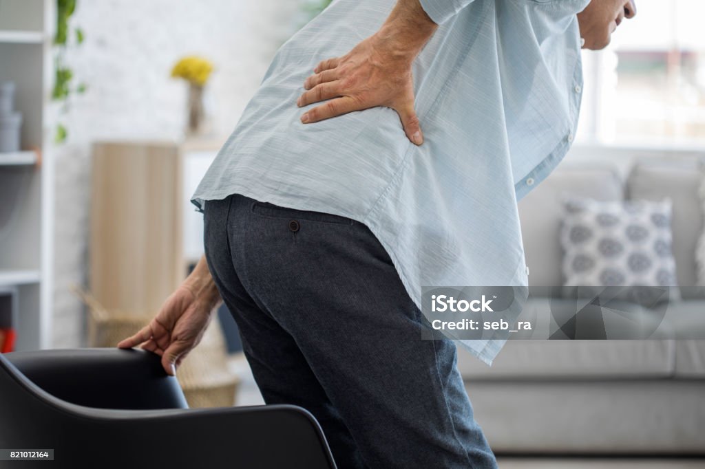 Old man with back pain Backache Stock Photo