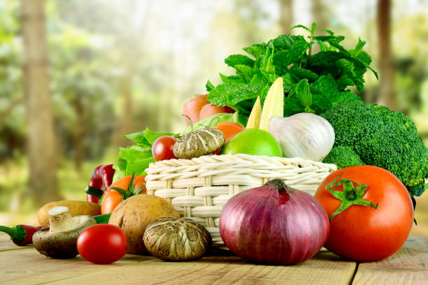 istock Fresh vegetables on wooden and blurred garden background. 821018712
