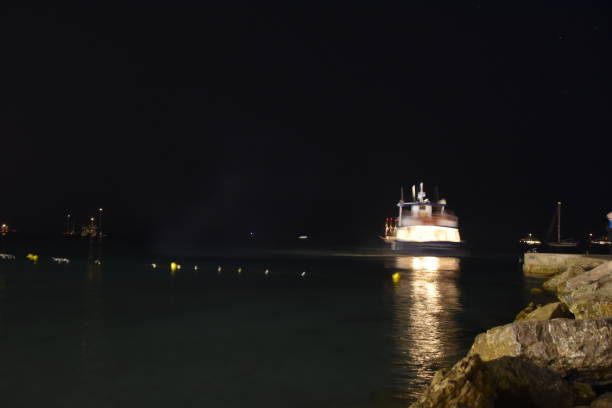 istock A boat in the sea at night 821024878