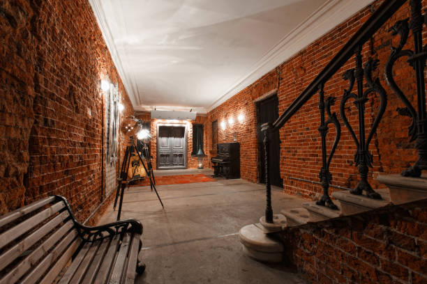 istock Modern industrial creative workspace. staircase with textured brick walls to the attic loft 821034612