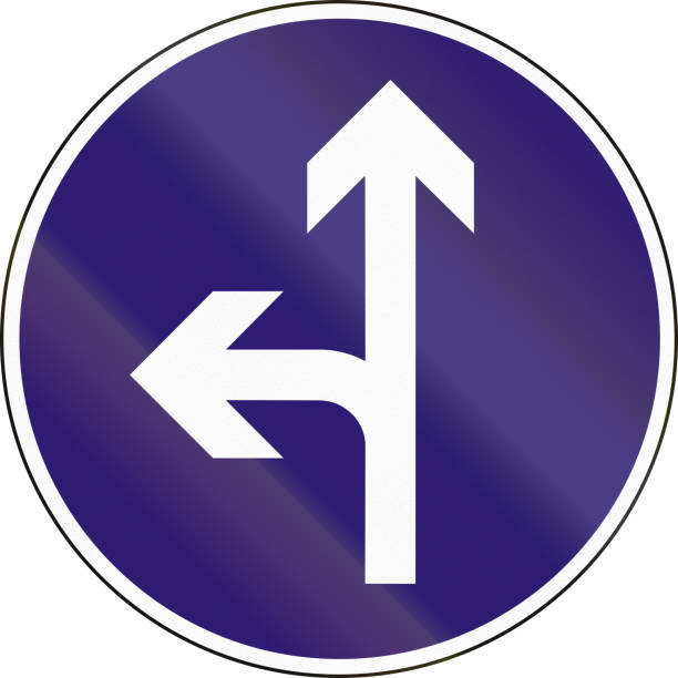 istock Road sign used in Hungary - Straight or left ahead 821034678