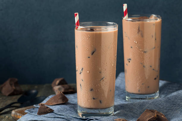 Cold Refreshing Iced Hot Chocolate Milk Cold Refreshing Iced Hot Chocolate Milk with Ice chocolate shake stock pictures, royalty-free photos & images
