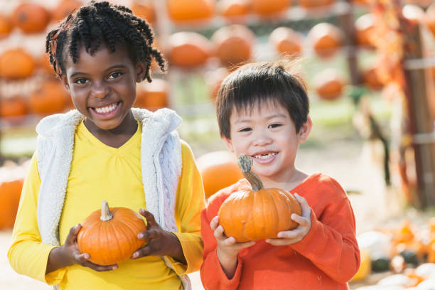 istock Friends at pumpkin stand 821042718