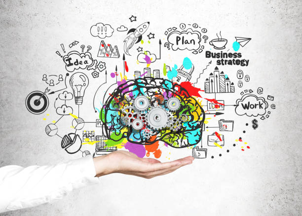 istock Woman s hand holding brain with cogs 821046398