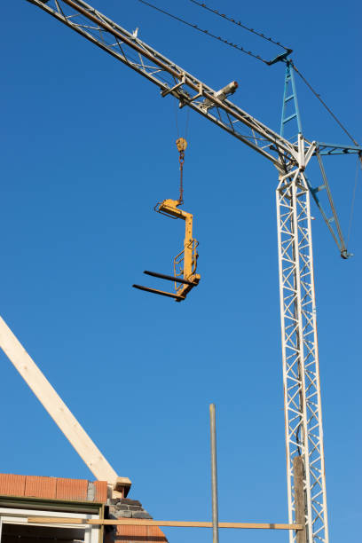 This building crane is used to build a house in my neighbourhood. The pictures are taken just before sunset.