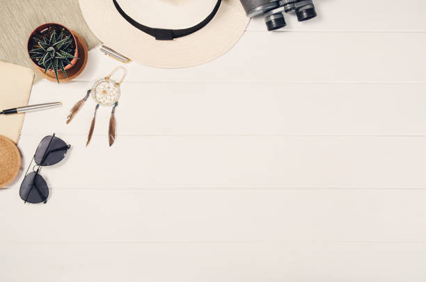istock Accessories for travel top view on white wooden background frame 821065214