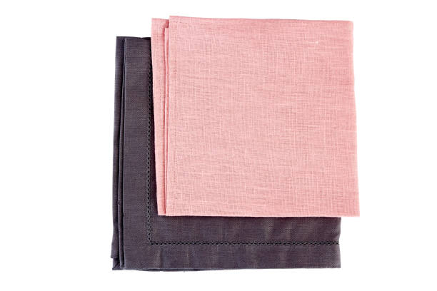 istock Folded gray and pink textile napkins on white 821081680