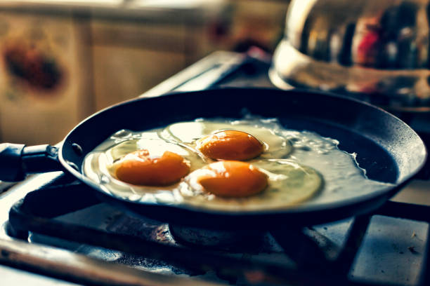 istock Eggs fry in a frying pan 821087428