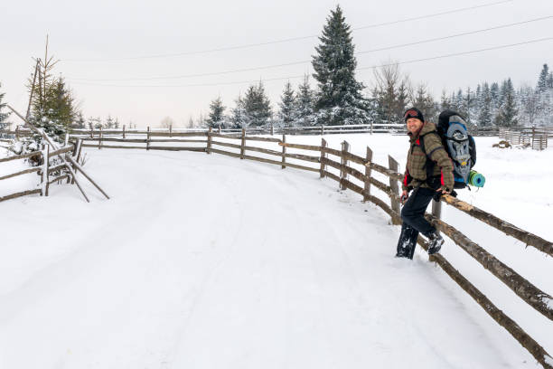 istock Tourist with backpack in Carpathian in winter 821087744