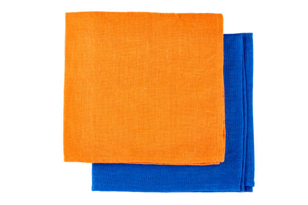 istock Folded orange and blue textile napkins on white 821092574
