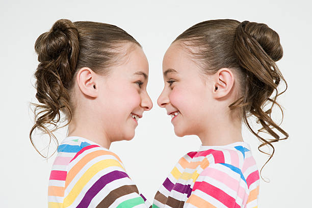 twins 顔、顔、顔 - people child twin smiling ストックフォトと画像