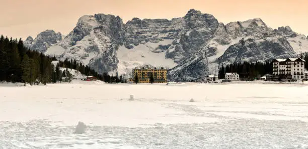 Lake of Misurina with Sorapiss Group on the background in the Dolomites of Sesto. Winter season Italy.