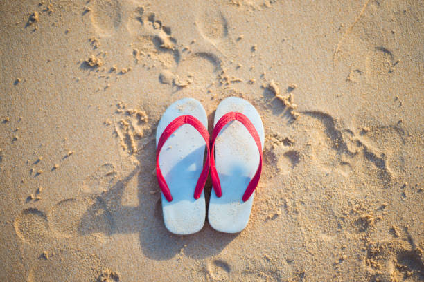 istock red and white sandal on the beach 821104276