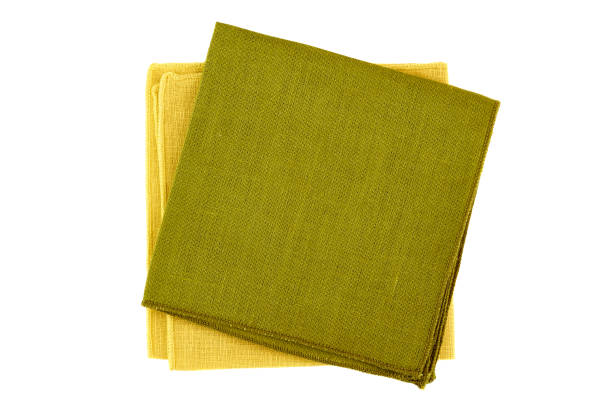 istock Green and yellow textile napkins on white 821104656