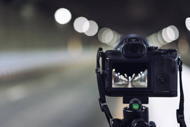 istock camera on tripod on subway tunnel with light bokeh 821111228