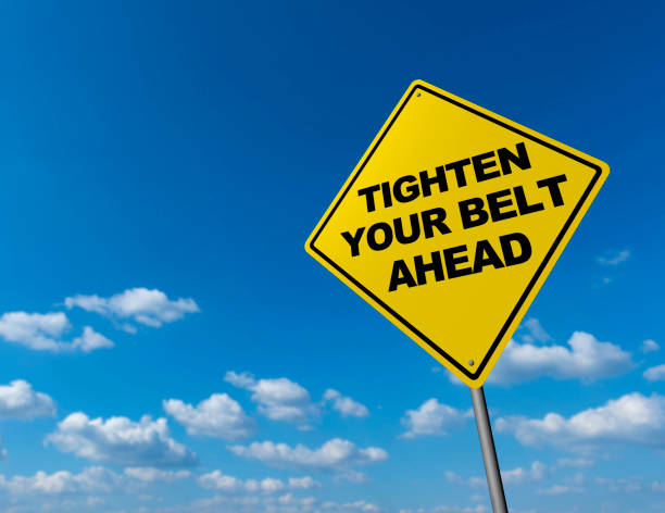 istock TIGHTEN YOUR BELT AHEAD - Road Warning Sign 821111284
