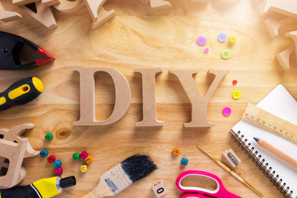 DIY Wood Font Style On a Wooden Workbench Top View.Do it Yourself concept DIY Wood Font Style On a Wooden Workbench Top View.Do it Yourself concept diy stock pictures, royalty-free photos & images