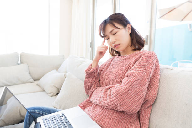 istock woman who has a pain in a head 821118522