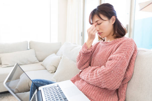 istock woman who has a pain in a head 821120708
