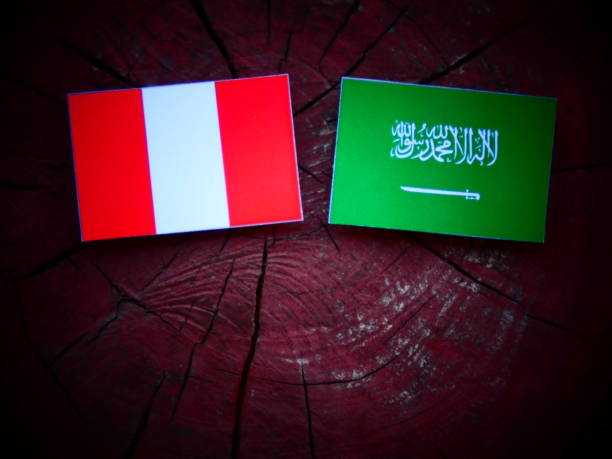 istock Peruvian flag with Saudi Arabian flag on a tree stump isolated 821134746