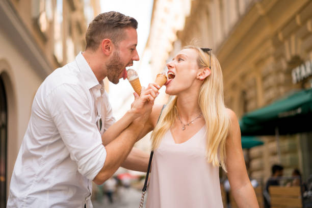 istock couple eating icecream cones 821135586