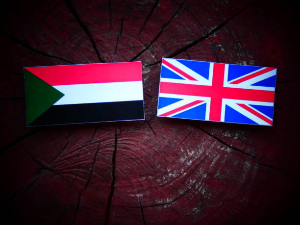 istock Sudan flag with UK flag on a tree stump isolated 821141650