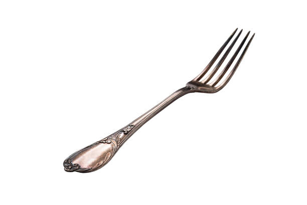 istock old antique cutlery fork isolated, clipping path included 821141686
