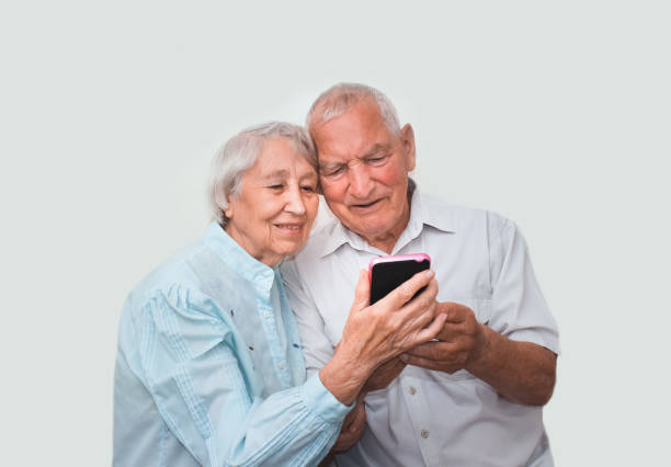 istock Senior couple at home using smartphones 821142006