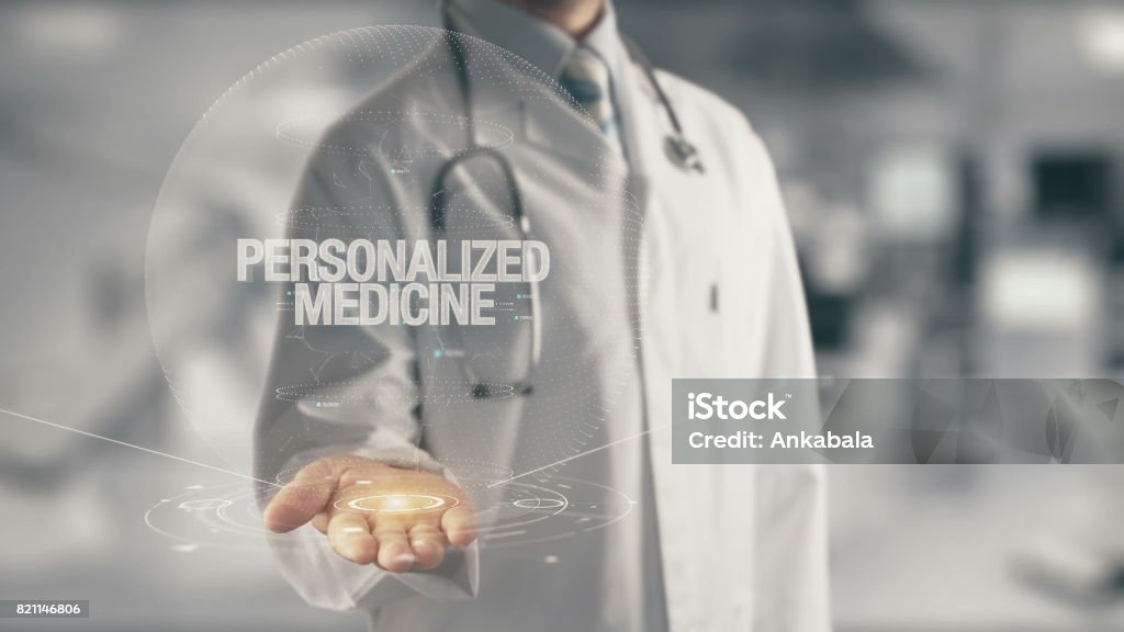 Doctor holding in hand Personalized Medicine Concept of application new technology in future medicine Business Person Stock Photo