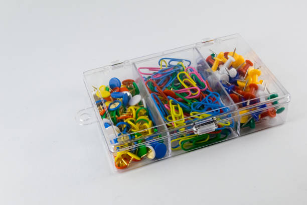 istock box of push pins and paper clips 821154688