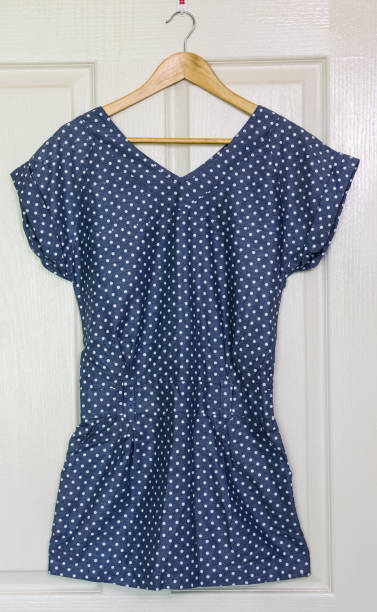 istock Vintage dress on hanger on a wall 821160822