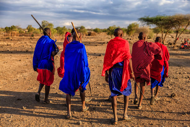 Group of Maasai warriors going back to village, Kenya, Africa