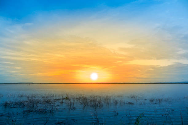istock the sunset on river and sky and clouds 821161916