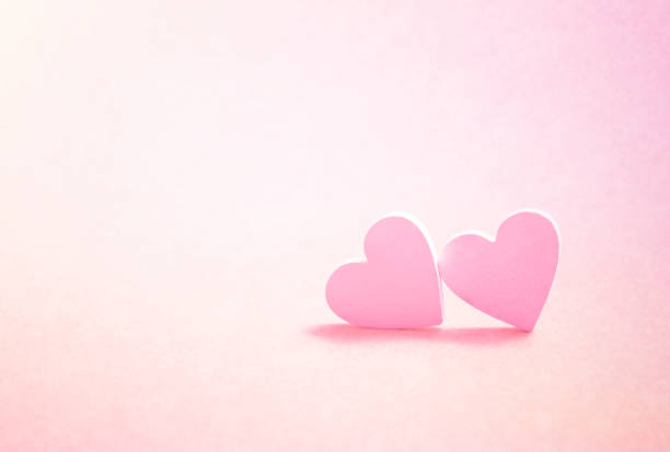 istock Valentine's Day greeting card. Two pink hearts 821162330