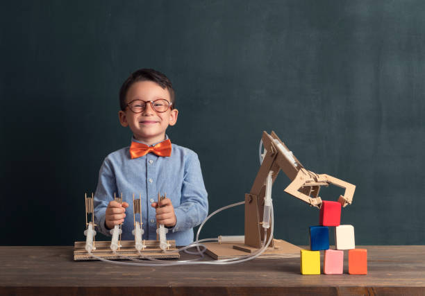 The child invented a robotic arm. He used cardboard and syringe. This is an innovation for her. He is a successful student at the age of 4-5. Robotic is technology of future.
