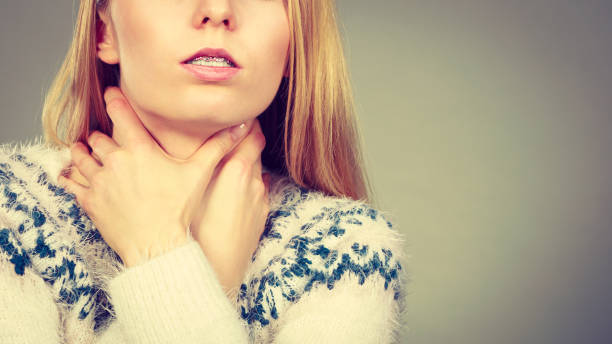 istock Woman having sore throat feeling pain 821168862