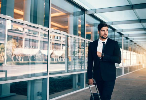 istock Business executive carrying suitcase in airport 821172200