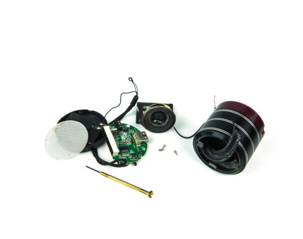 istock Men hand are catching the small speaker repair. 821173052