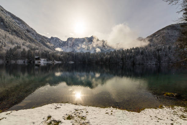istock first snow at the mountain lake 821184358